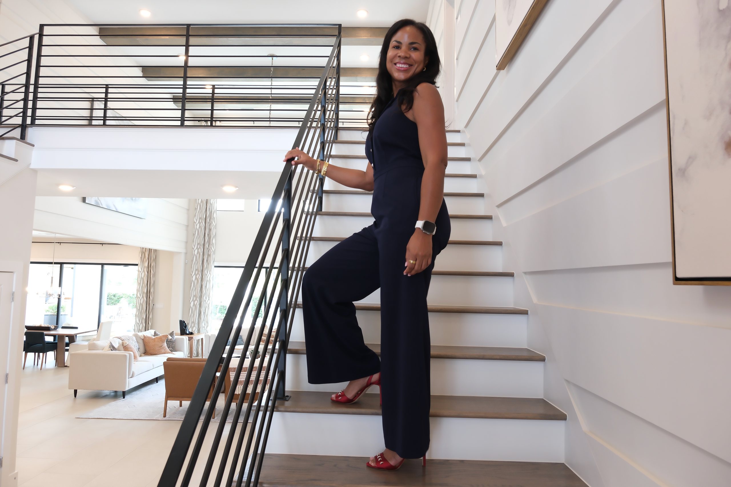 Lliliam Foster on a staircase, smiling